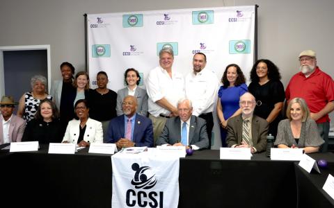 Congressmen Steny Hoyer and Glenn Ivey take a group photo with meeting attendees.